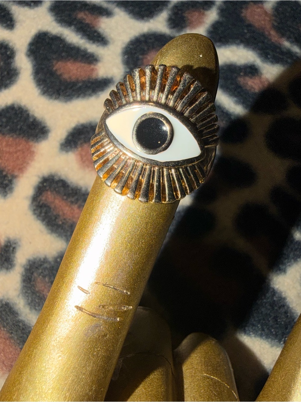 vintage style gold eye ring with white eye design and radiating lines